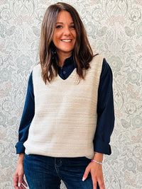 Gilet in maglia misto lana senza maniche con scollo a V. Lavorazione a costine e sfumature melange.